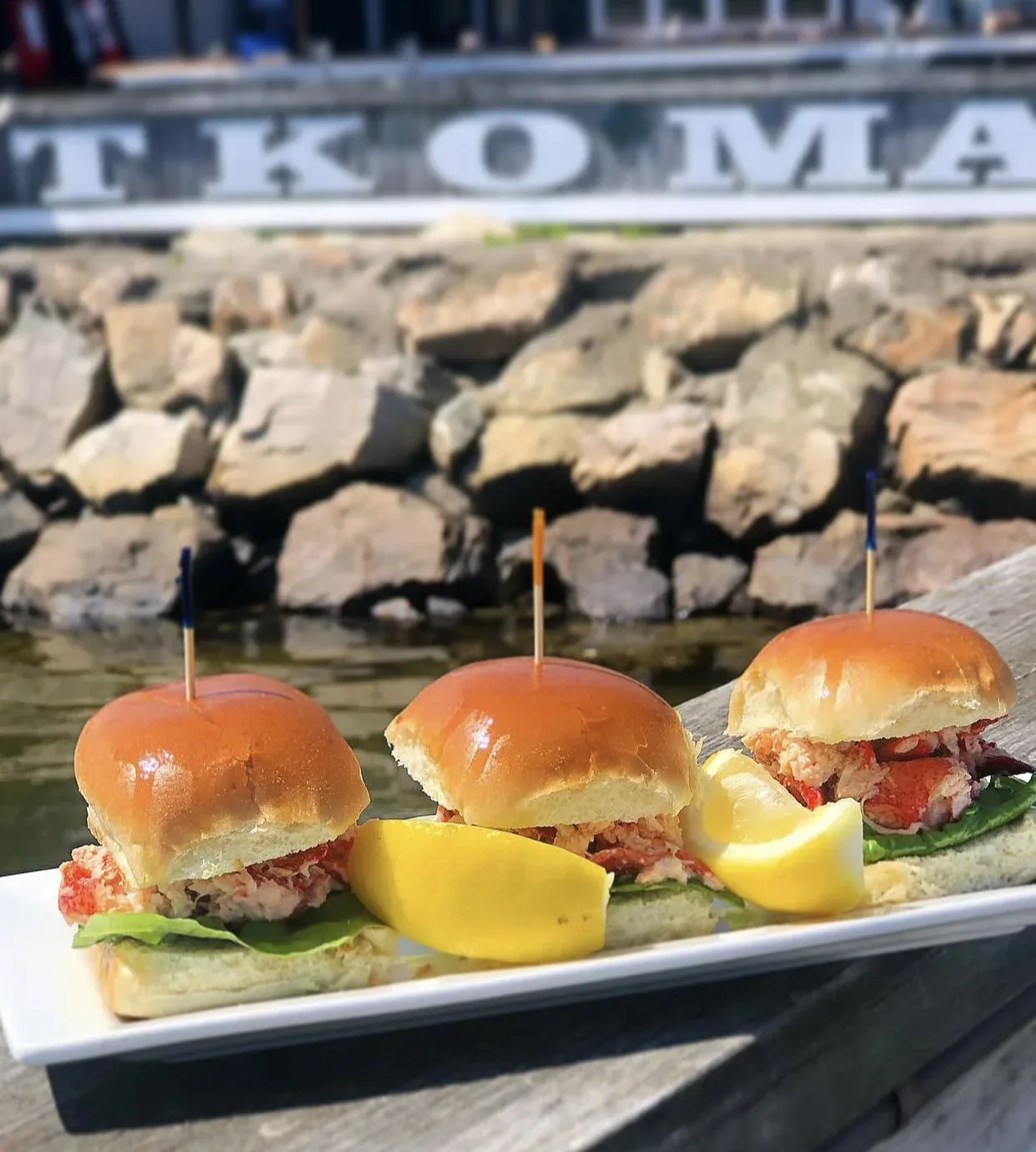Lobster sliders with TKO Malley's sign in the background